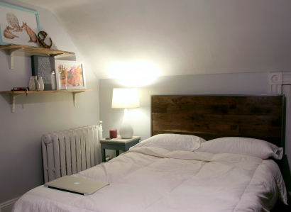 reclaimed repurposed antique salvaged walnut flooring used for a bedroom headboard by longleaf lumber