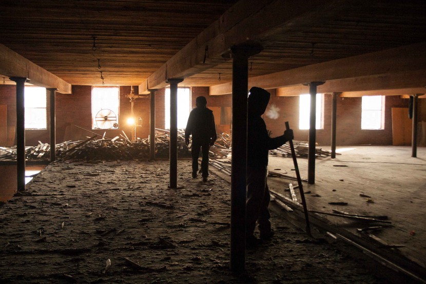 Workers in Mill Number 12 Annex in Manchester, New Hampshire, where Longleaf Lumber reclaimed maple flooring and Heart Pine beams.