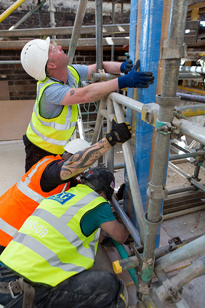 Reclaimed Heart Pine Beam Installation at GSA Mackintosh Building