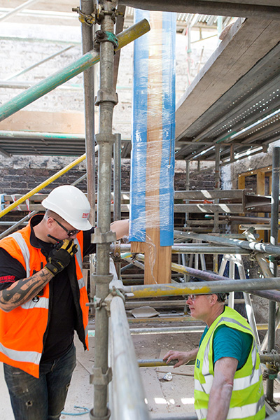 Reclaimed Heart Pine Beam Installation at GSA Mackintosh Building