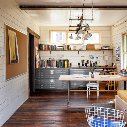 Reclaimed Skip-Planed Heart Pine Flooring and Painted Spruce Paneling