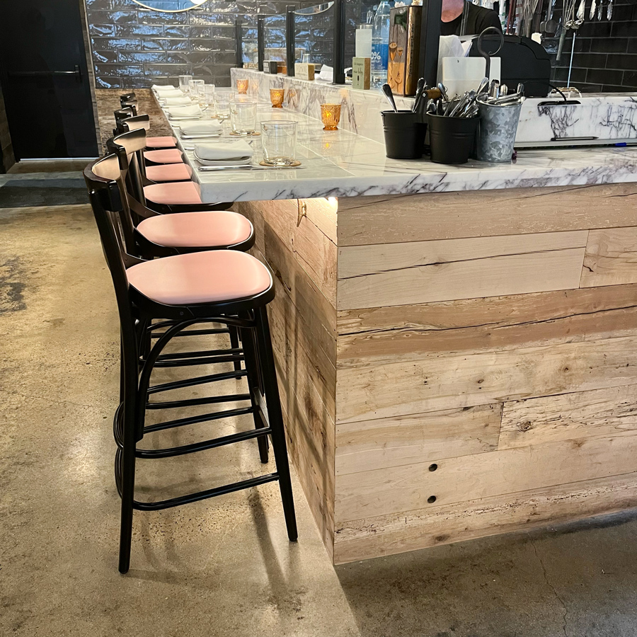 Reclaimed maple paneling on restaurant bar front Reclaimed maple paneling on restaurant bar front