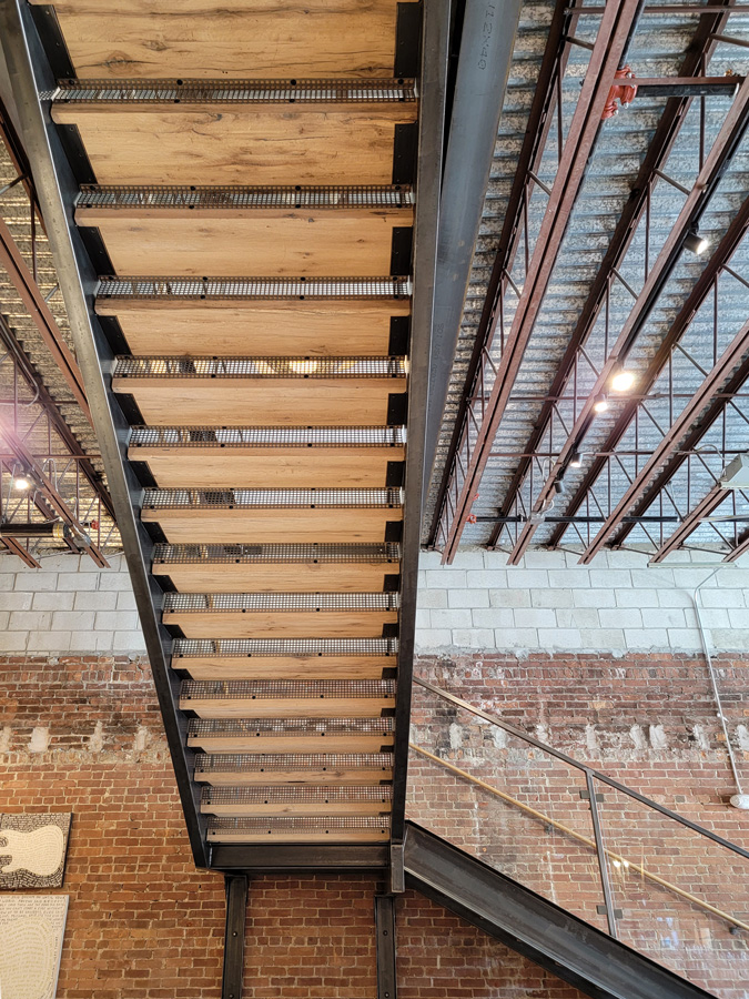 Reclaimed white oak stair treads in retail store Reclaimed white oak stair treads in retail store