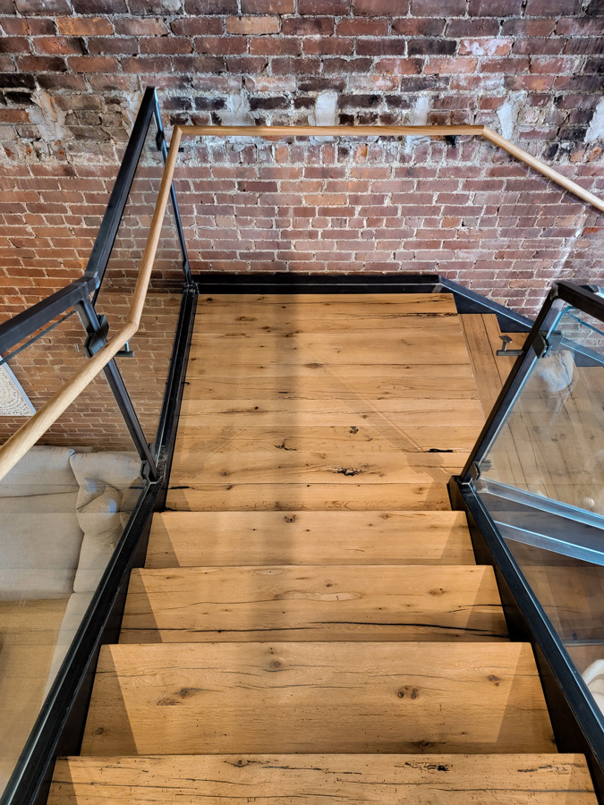 Reclaimed white oak stair treads in retail store Reclaimed white oak stair treads in retail store