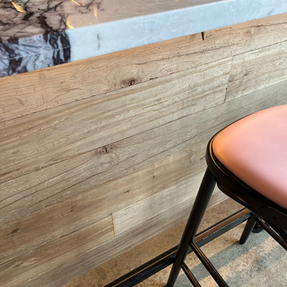 Reclaimed maple paneling on restaurant bar front