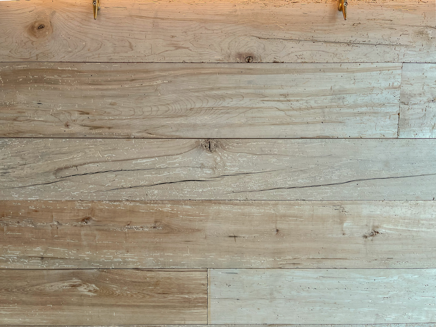 Reclaimed maple paneling on restaurant bar front Reclaimed maple paneling on restaurant bar front