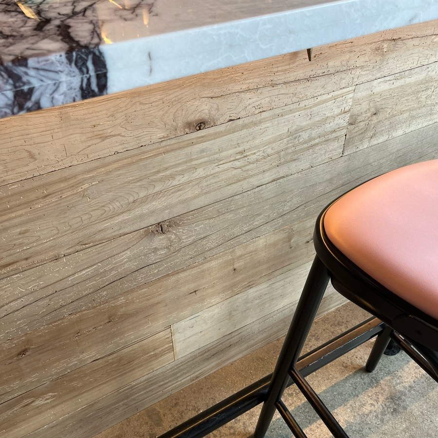 Reclaimed maple paneling on restaurant bar front Reclaimed maple paneling on restaurant bar front